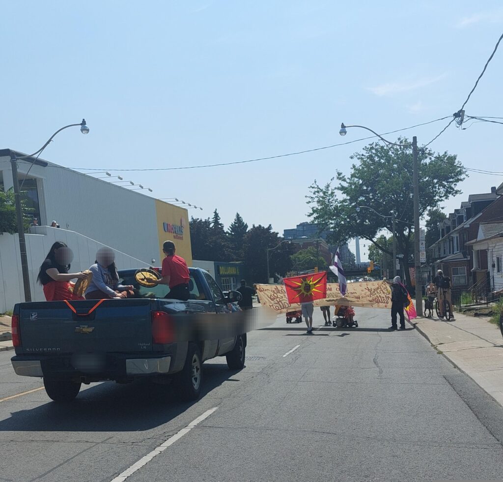 Photo: a sunny day on Carlaw Street, approaching the now-gone No Frills store at Gerrard Street.